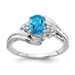 14k White Gold 7x Oval Blue Topaz and 1/15 carat VS Diamond Ring