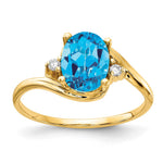14k 8x Oval Blue Topaz and 1/20 carat VS Diamond Ring