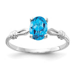 14k White Gold 7x Oval Blue Topaz ring
