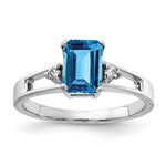 14k White Gold 7x Emerald-cut Blue Topaz and 1/20 carat VS Diamond Ring